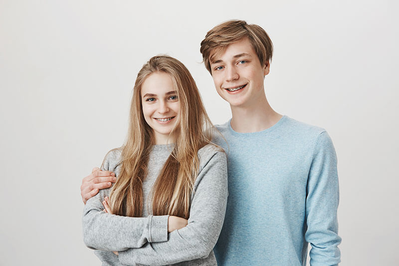 teen boy and girl with braces