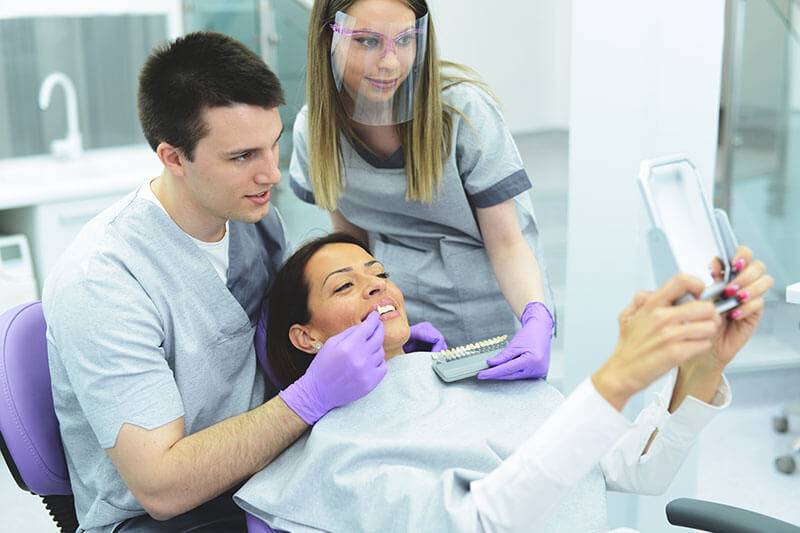 female patient getting porcelain veneers